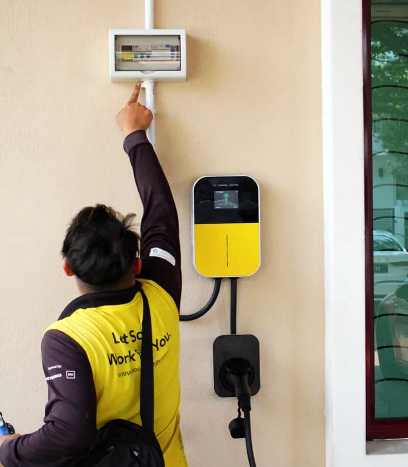 ChargeSingh installer configuring EV charger